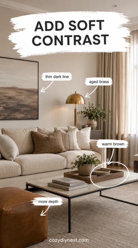 beige living room with soft contrast from warm brown brass and darker frame accents